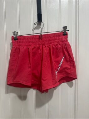 Nike Women's Bright Red Athletic Shorts with Silver Swoosh Detail
